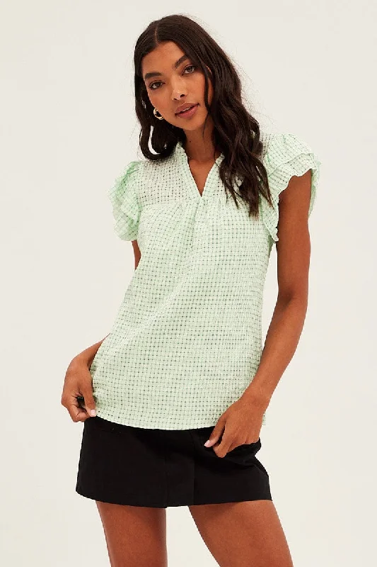 women's tops for those who want to stay on top of the latest fashion trends and wear pieces that are both stylish and on-trendGreen Ruffle Sleeve Top